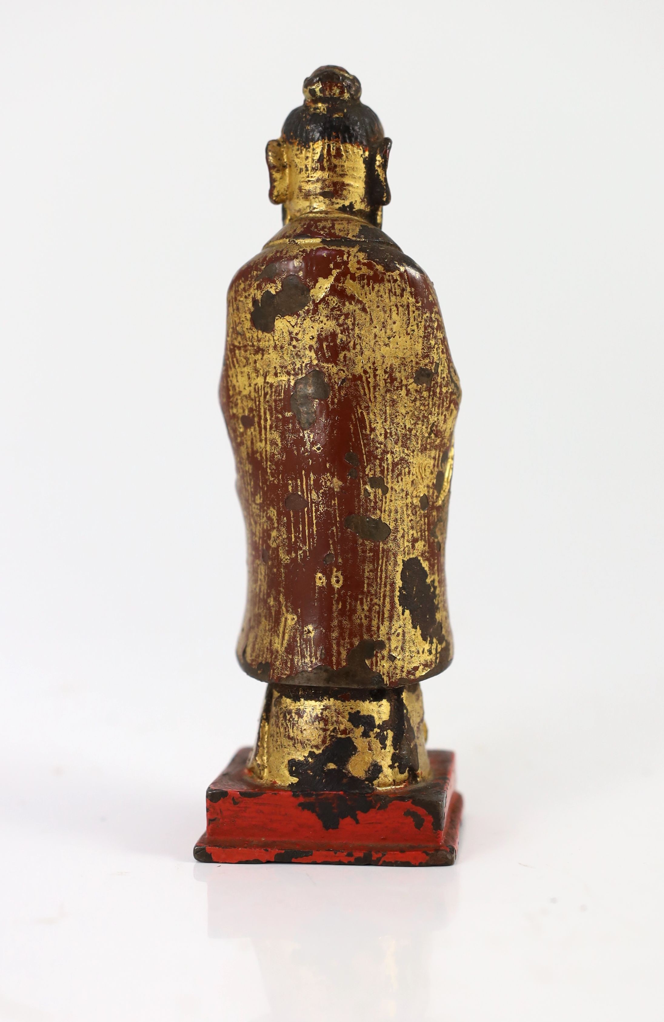 A Chinese Ming lacquered bronze figure of an official holding a tablet, 15cm